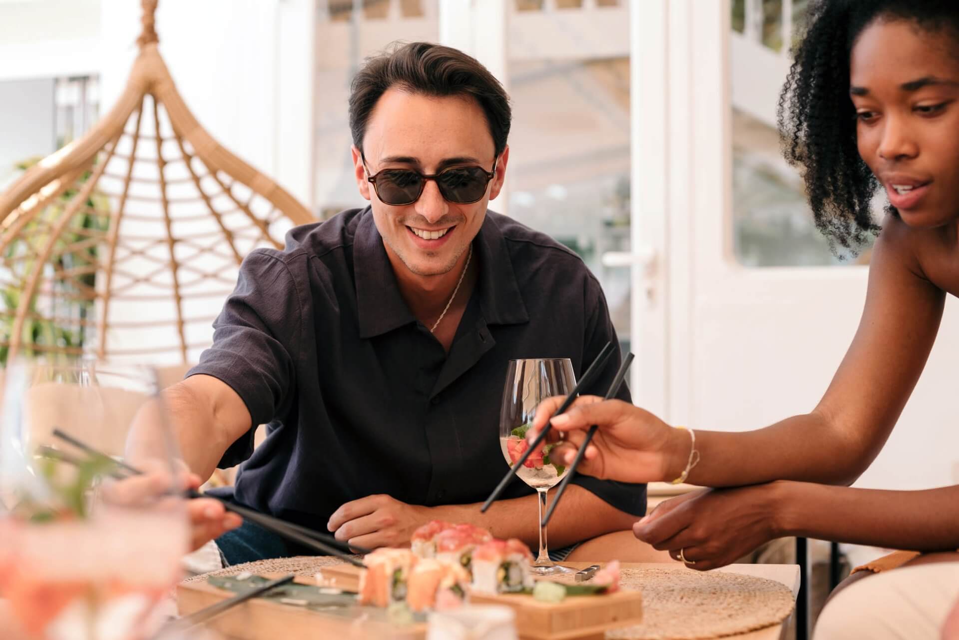 two people eating sushi near the wellory huntsville apartments